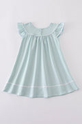Blue cross embroidery dress for children, featuring playful patterns and soft fabric.