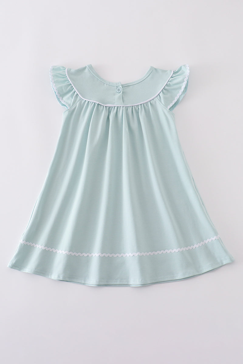 Blue cross embroidery dress for children, featuring playful patterns and soft fabric.
