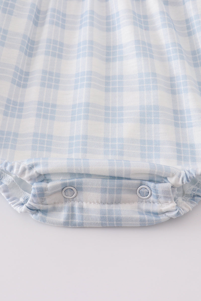 Blue plaid bubble romper with "He is Risen" embroidery, perfect for Easter.