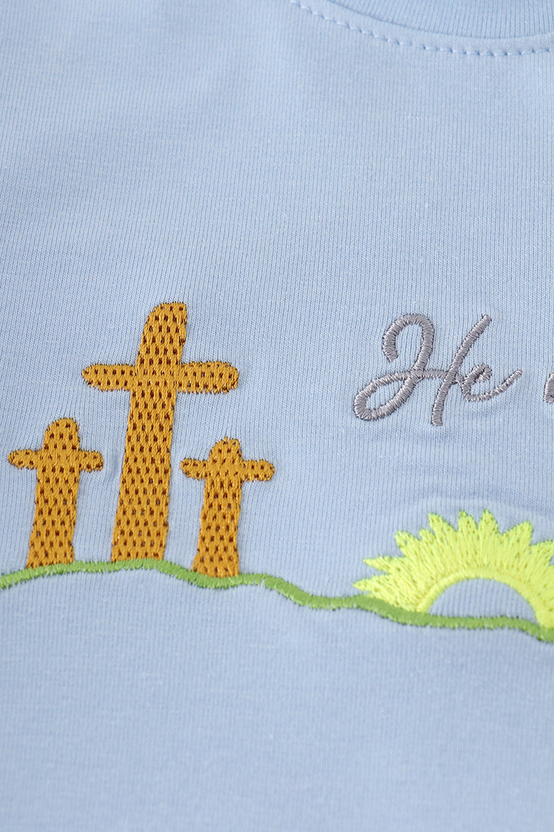 Blue plaid children's outfit with "He is Risen" embroidery, perfect for Easter.
