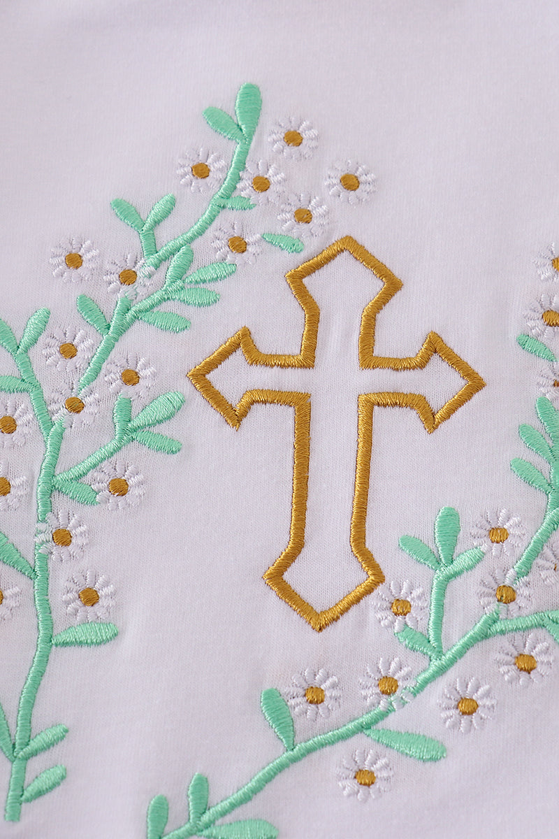 Pastel pink bubble romper with delicate Easter cross embroidery, perfect for spring celebrations.