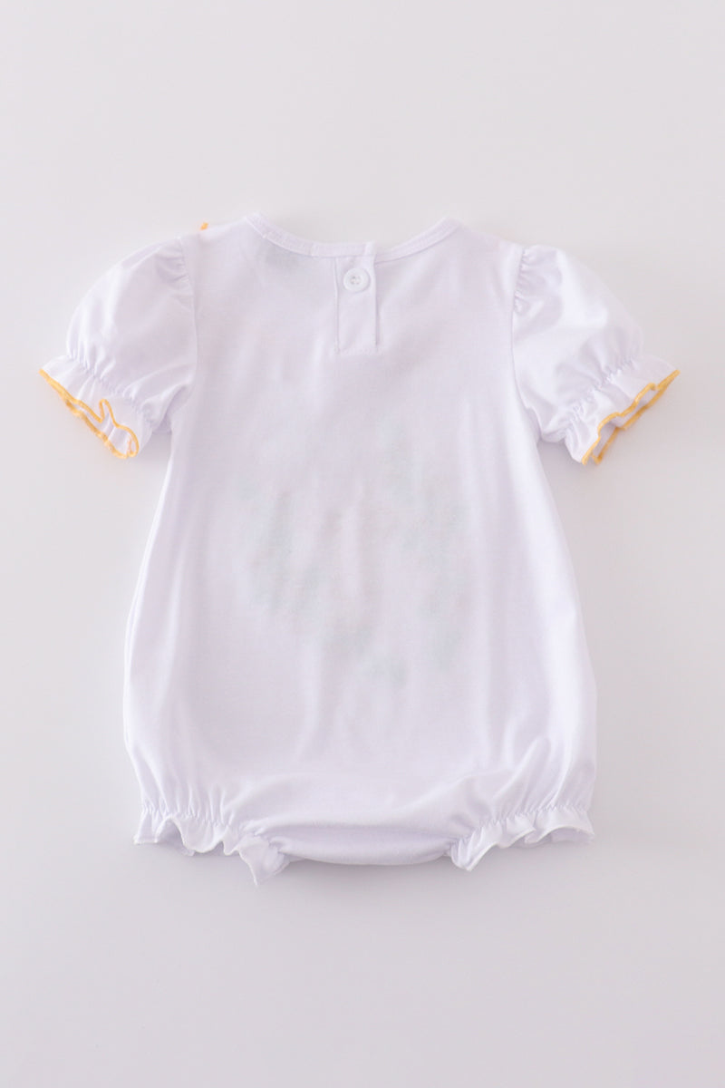 Pastel pink bubble romper with delicate Easter cross embroidery, perfect for spring celebrations.