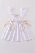 A pastel pink dress with Easter cross embroidery, perfect for spring celebrations.