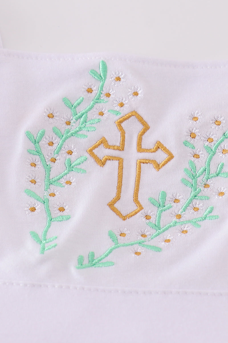 A pastel pink dress with Easter cross embroidery, perfect for spring celebrations.