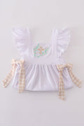 A pastel pink dress with Easter cross embroidery, perfect for spring celebrations.