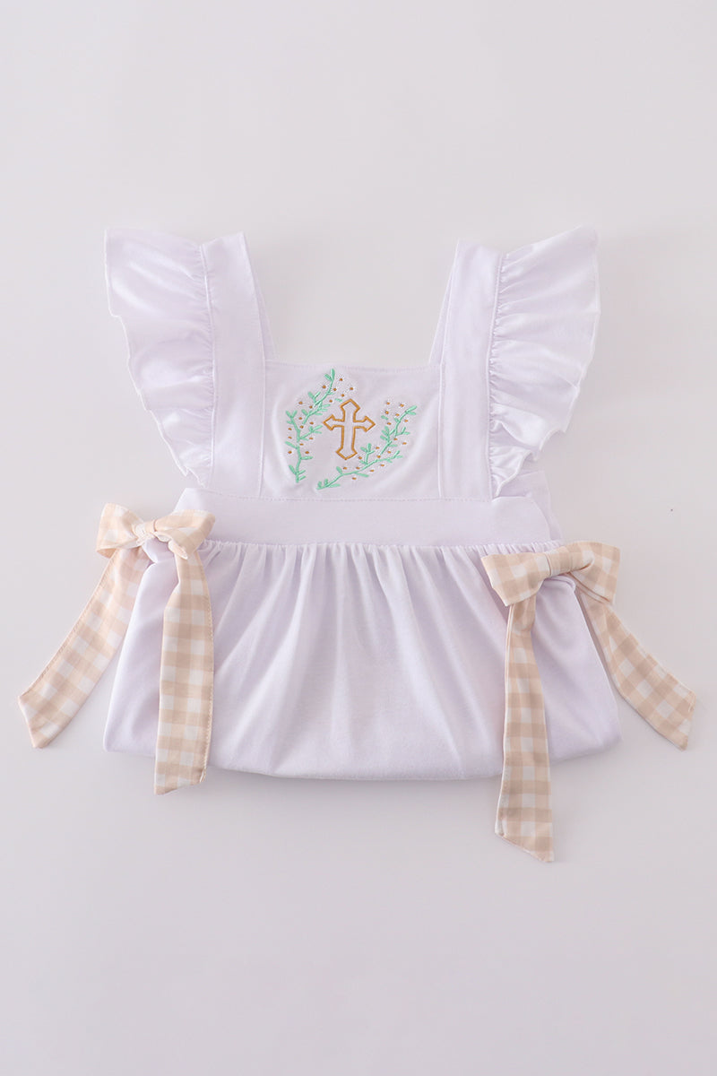 A pastel pink dress with Easter cross embroidery, perfect for spring celebrations.