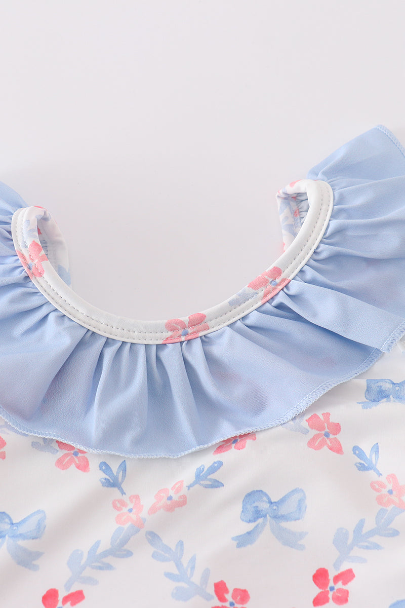 A charming blue lattice print swimsuit with a cute bow, perfect for summer fun.