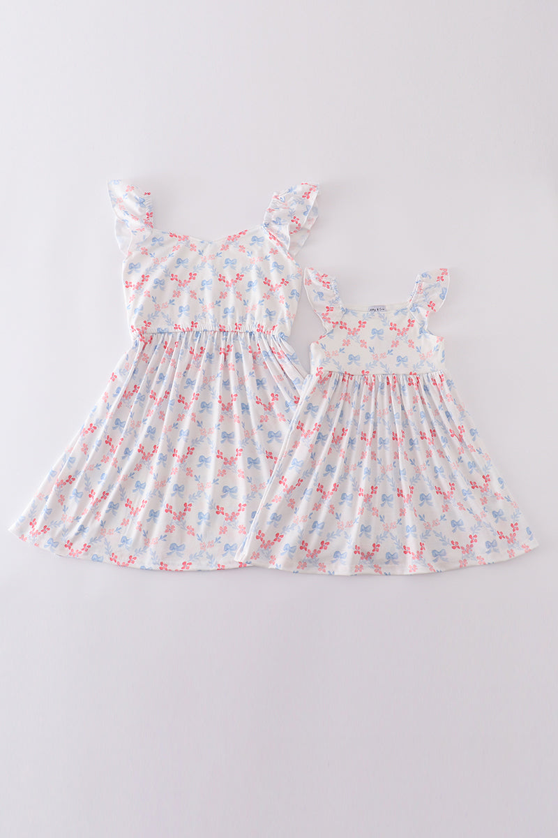 Matching blue lattice print dresses with bows, perfect for mom and daughter outings.