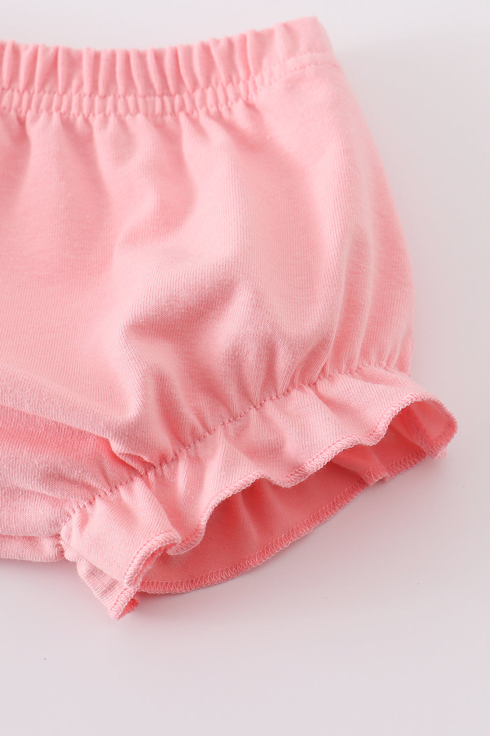 Pink striped smocked bloomer set with cute animal embroidery, perfect for playtime.