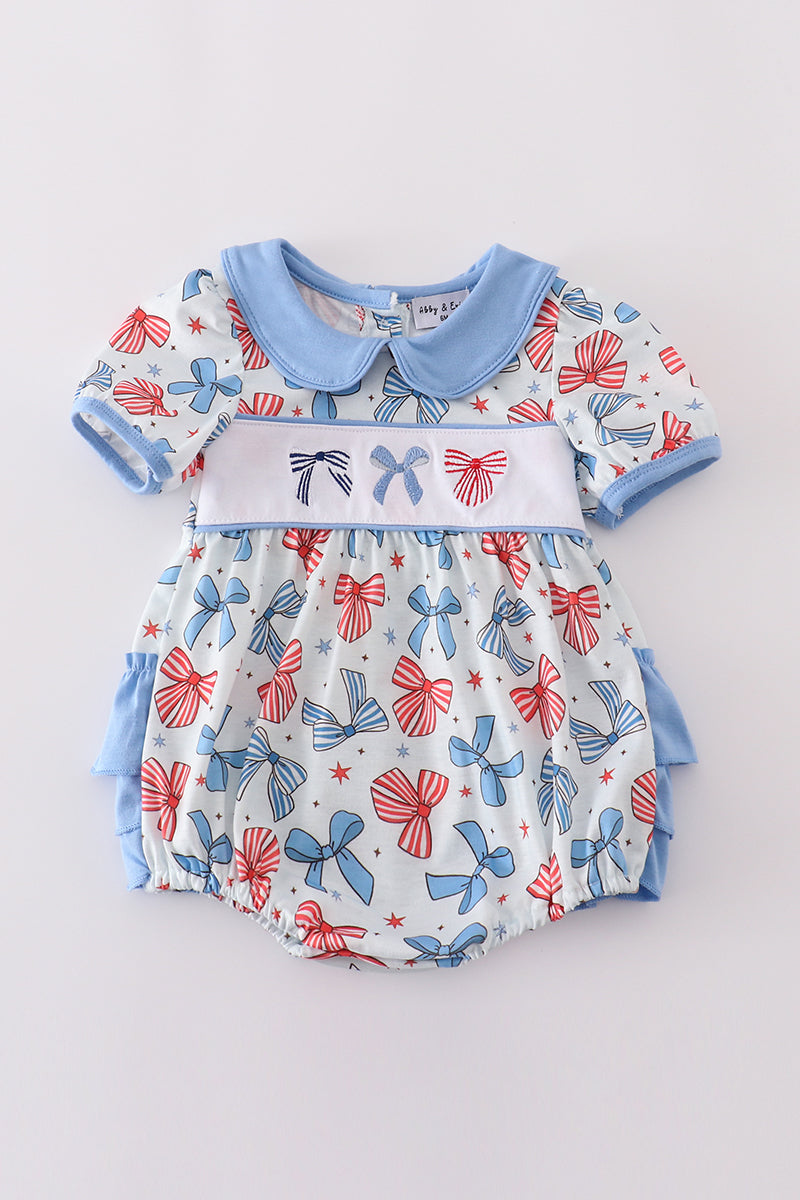 Adorable ruffle bubble with bow trellis print and delicate embroidery.