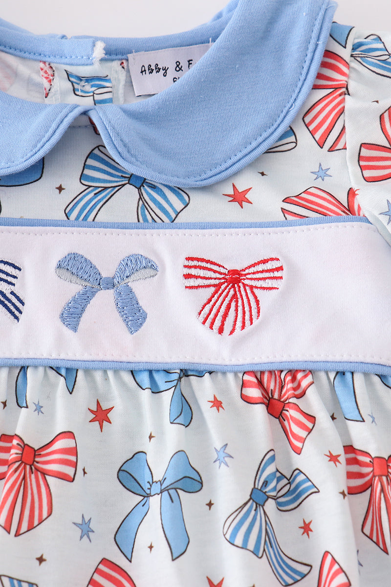 Adorable ruffle bubble with bow trellis print and delicate embroidery.