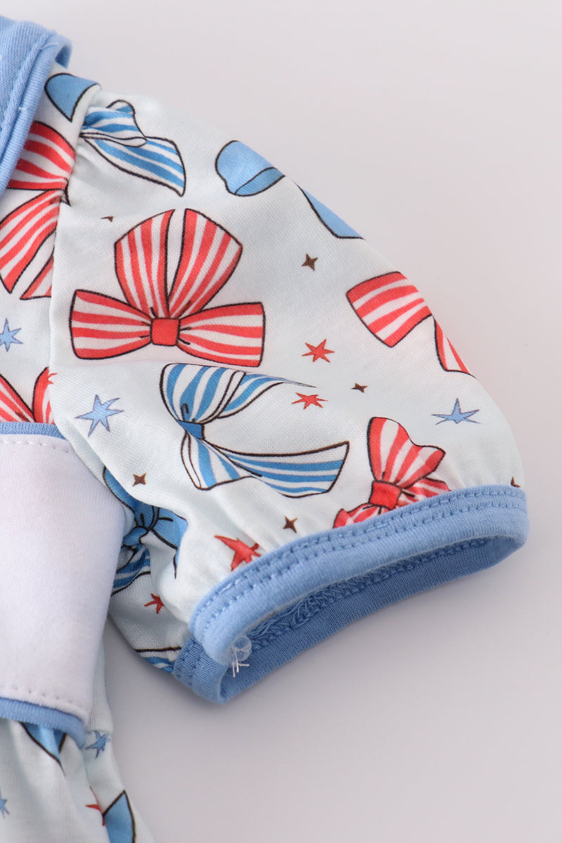 Adorable ruffle bubble with bow trellis print and delicate embroidery.