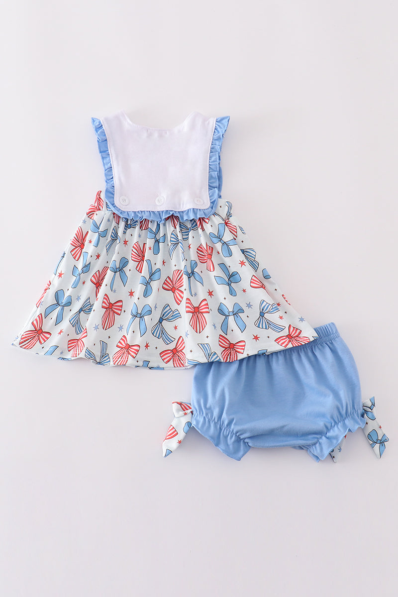 Adorable ruffle bloomer set with bow trellis print and embroidery.