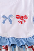 A sweet ruffle dress with bow trellis print and delicate embroidery, perfect for playdates.