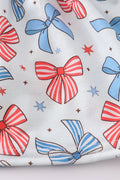 A sweet ruffle dress with bow trellis print and delicate embroidery, perfect for playdates.