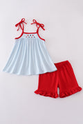 Gingham star embroidery set: blue and white checkered top and shorts with star details.