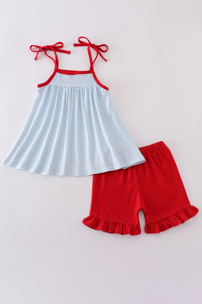 Gingham star embroidery set: blue and white checkered top and shorts with star details.