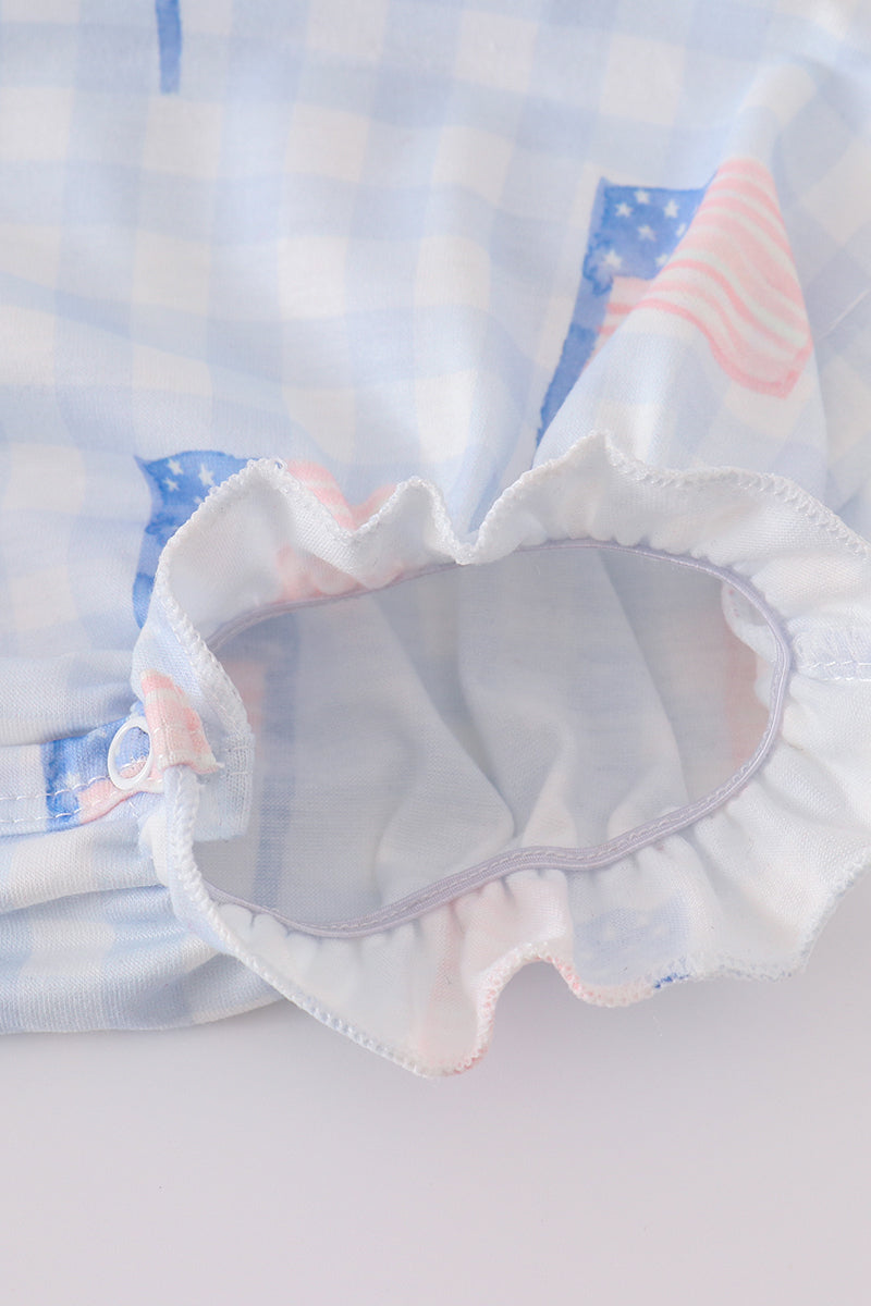 A charming gingham bubble romper with blue flag embroidery, perfect for summer.
