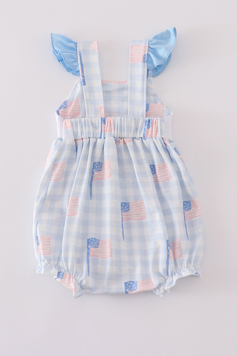 A charming gingham bubble romper with blue flag embroidery, perfect for summer.