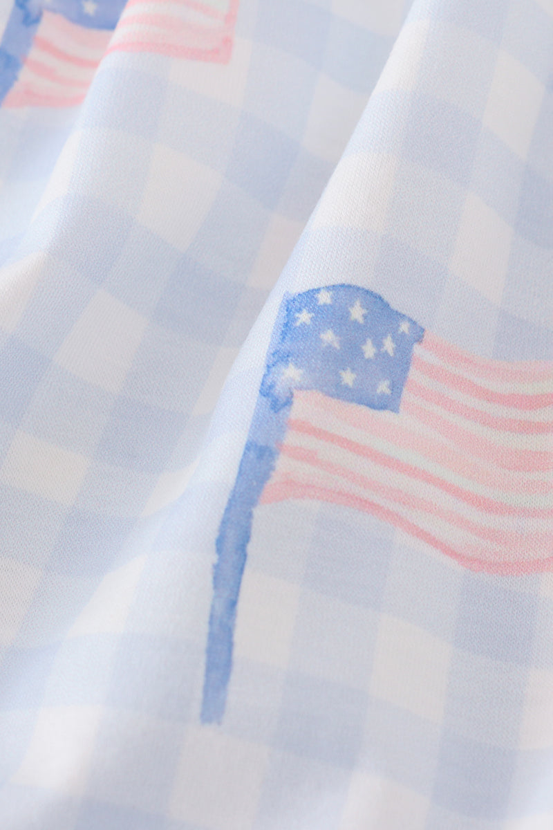 Blue gingham dress with smocked embroidery, perfect for summer outings.