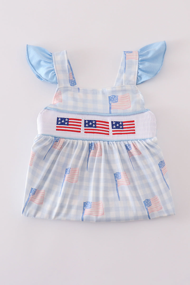 Blue gingham dress with smocked embroidery, perfect for summer outings.
