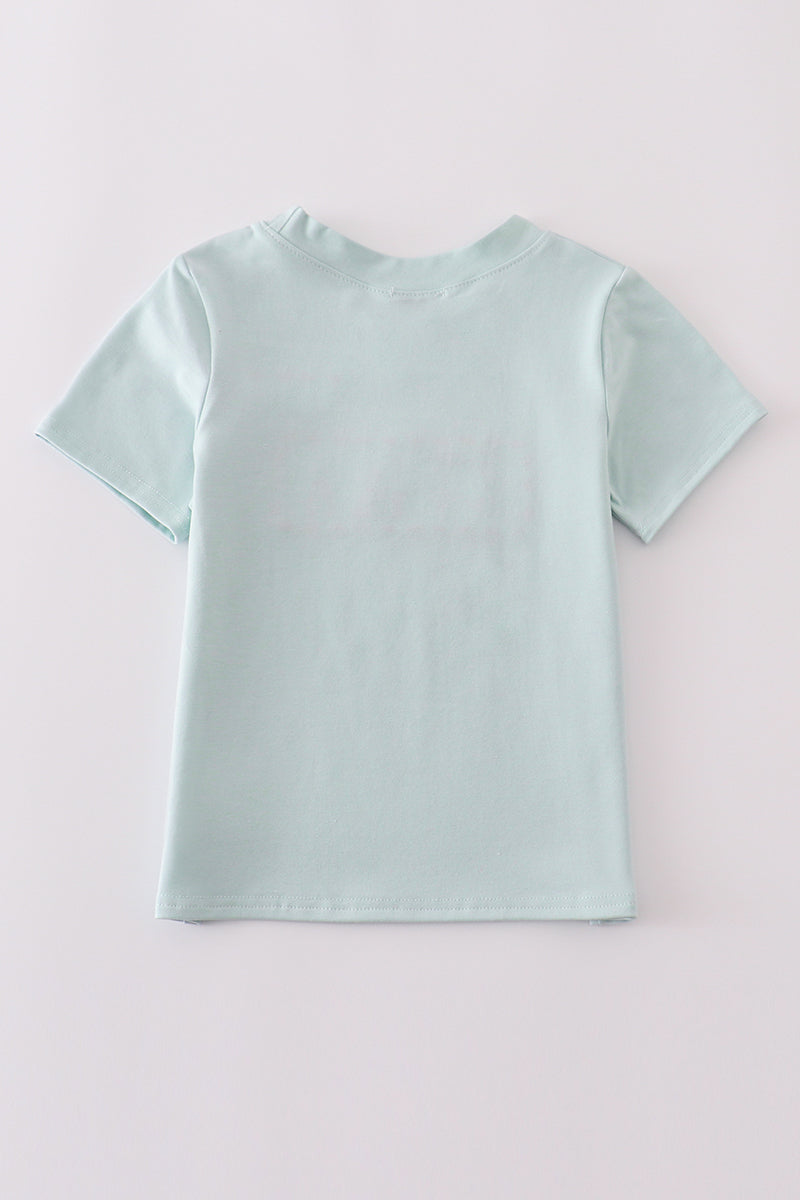 Blue embroidered top for kids with playful tool patterns, perfect for casual outings.