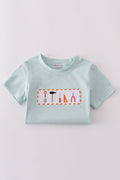 Blue embroidered top for kids with playful tool patterns, perfect for casual outings.
