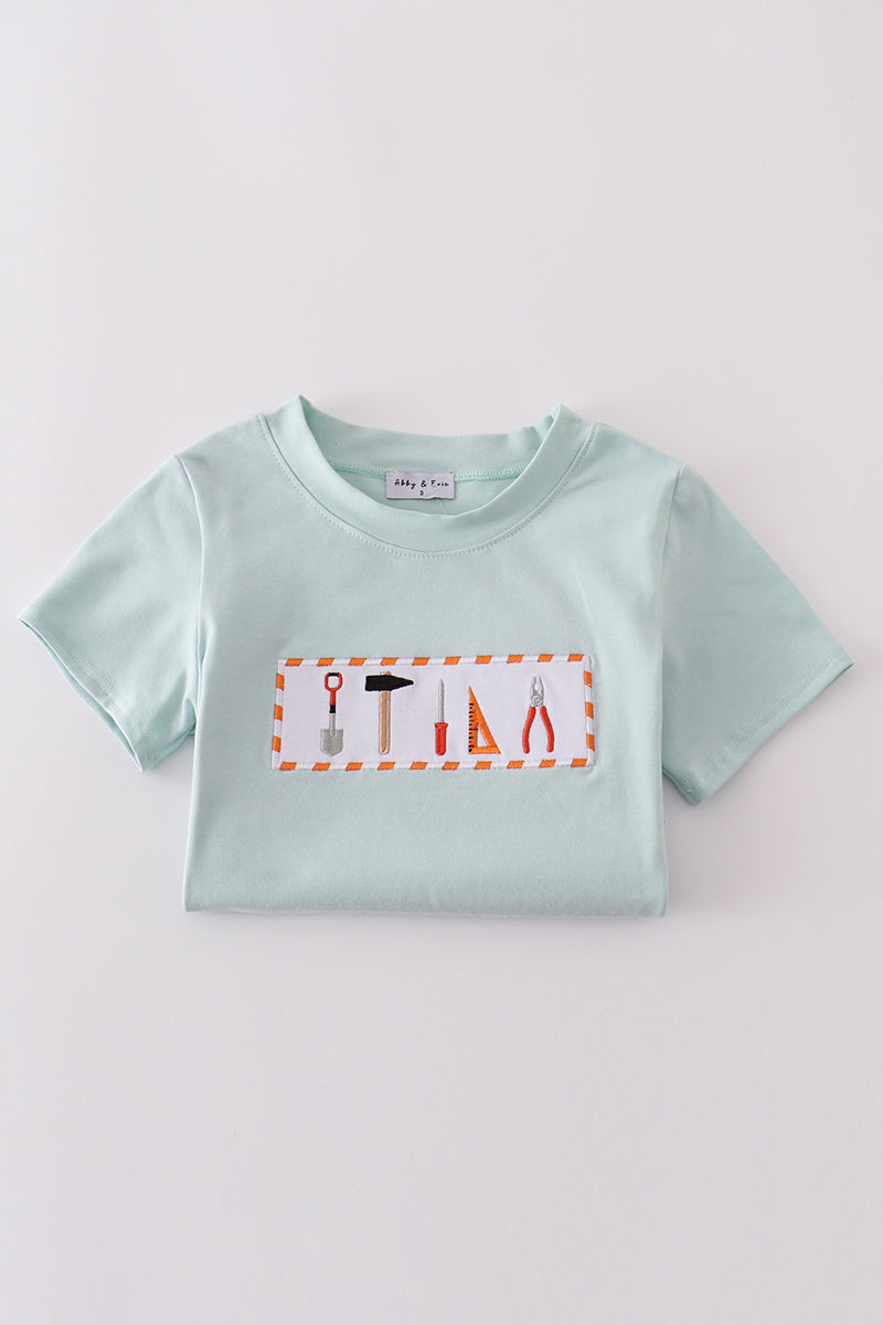 Blue embroidered top for kids with playful tool patterns, perfect for casual outings.