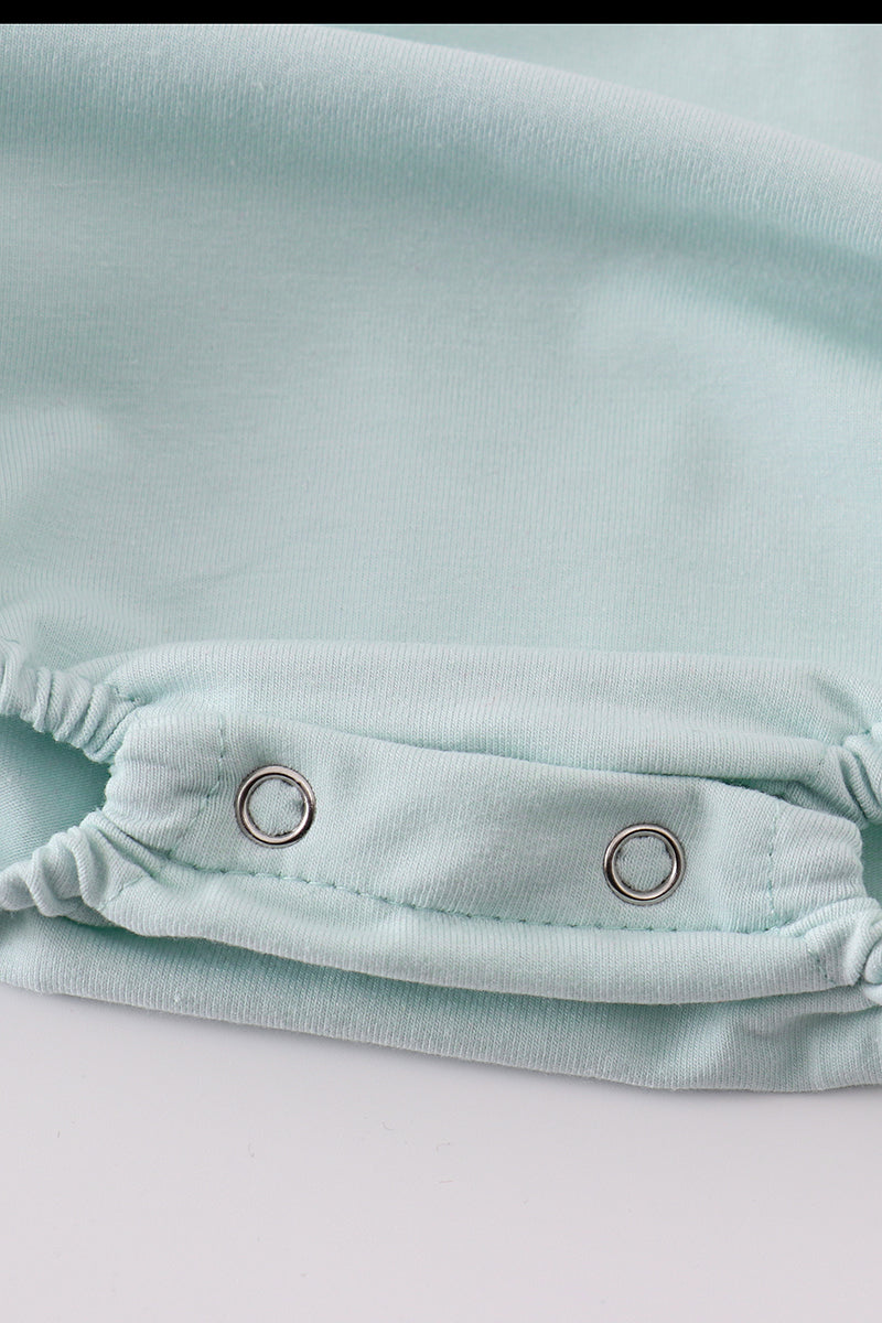 Adorable blue bubble romper with delicate tool embroidery, perfect for special occasions.