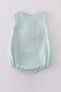 Adorable blue bubble romper with delicate tool embroidery, perfect for special occasions.