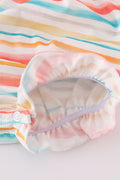 Colorful smocked bubble with rainbow stripes and marine creature embroidery.