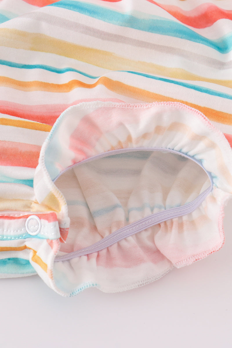 Colorful smocked bubble with rainbow stripes and marine creature embroidery.