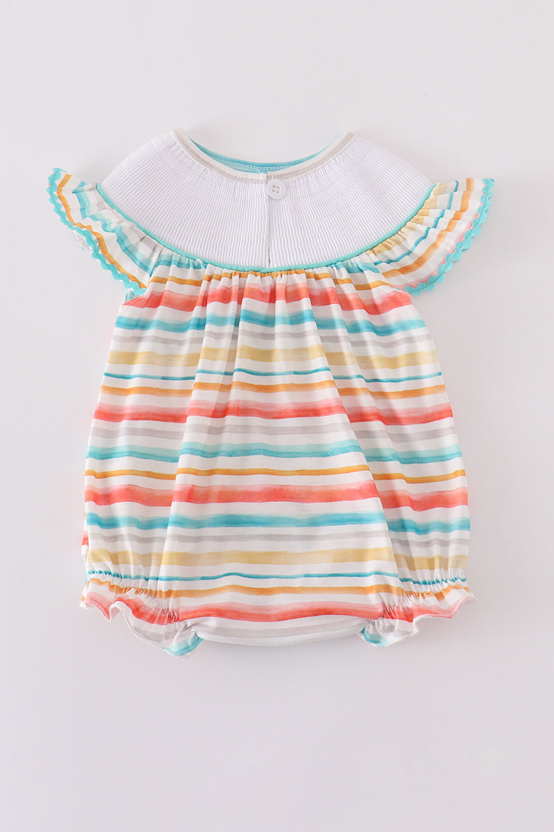 Colorful smocked bubble with rainbow stripes and marine creature embroidery.