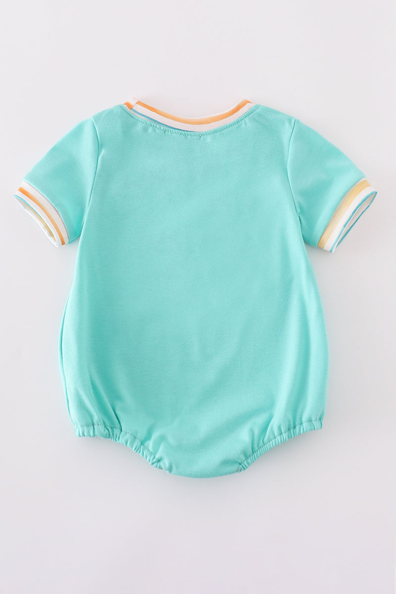 Adorable blue bubble romper with marine creature embroidery and smocked detailing.