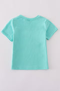 Children's blue smocked top with cute marine creature embroidery.