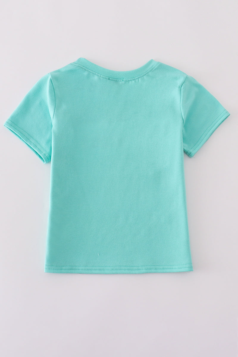 Children's blue smocked top with cute marine creature embroidery.
