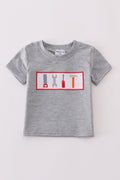 Grey tool embroidery top with playful patterns, perfect for everyday adventures.