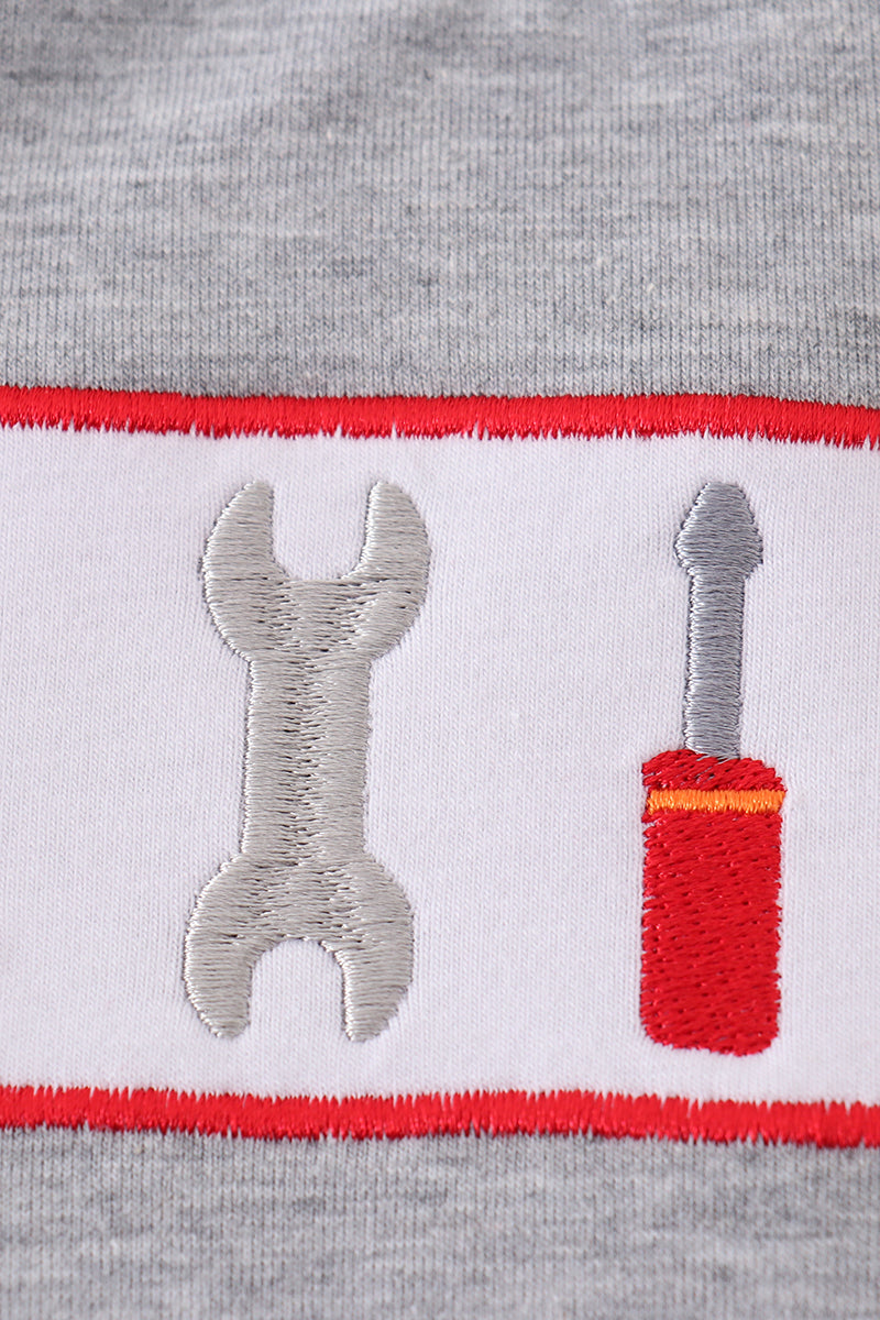 Grey tool embroidery top with playful patterns, perfect for everyday adventures.