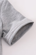 Grey tool embroidery top with playful patterns, perfect for everyday adventures.