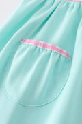 Mint gingham ruffle dress with princess embroidery, perfect for special occasions.