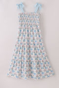Matching blue hydrangea bow smocked dresses with delicate floral pattern for mom and child.