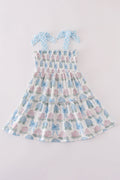 Matching blue hydrangea bow smocked dresses with delicate floral pattern for mom and child.