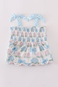Matching blue hydrangea bow smocked dresses with delicate floral pattern for mom and child.