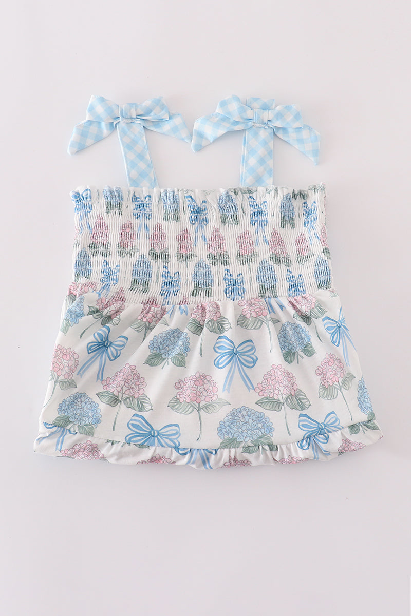 Matching blue hydrangea bow smocked dresses with delicate floral pattern for mom and child.