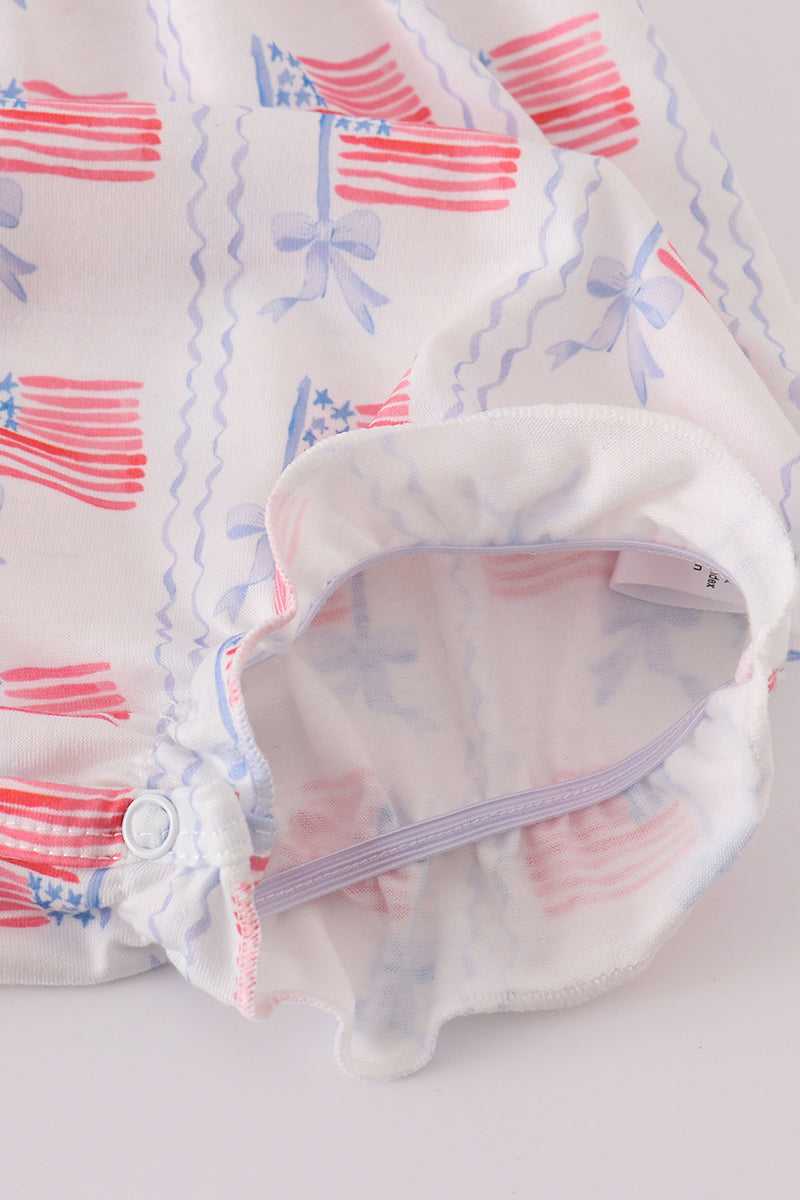 Adorable smocked bubble with bow embroidery, perfect for special occasions.