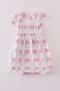 Adorable smocked bubble with bow embroidery, perfect for special occasions.