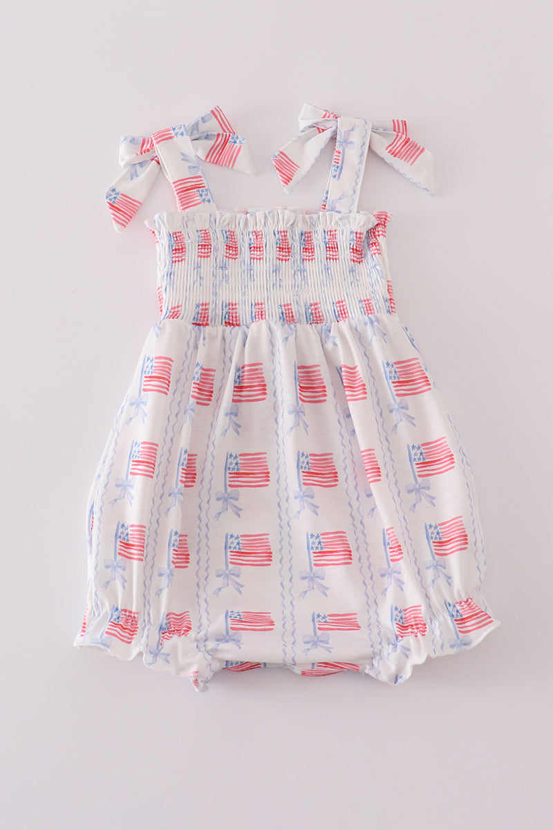 Adorable smocked bubble with bow embroidery, perfect for special occasions.