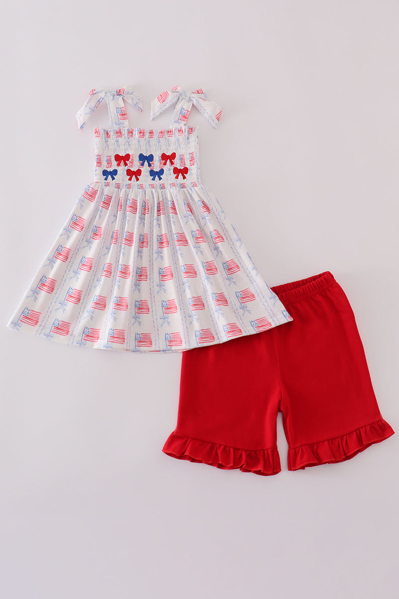 Adorable smocked shorts set with bow embroidery, perfect for playful summer days.