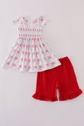 Adorable smocked shorts set with bow embroidery, perfect for playful summer days.