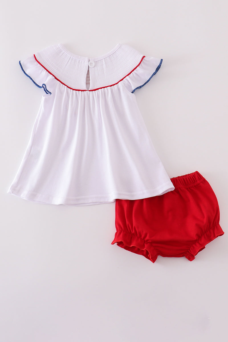Adorable flag-embroidered bloomer set with a patriotic theme for toddlers.